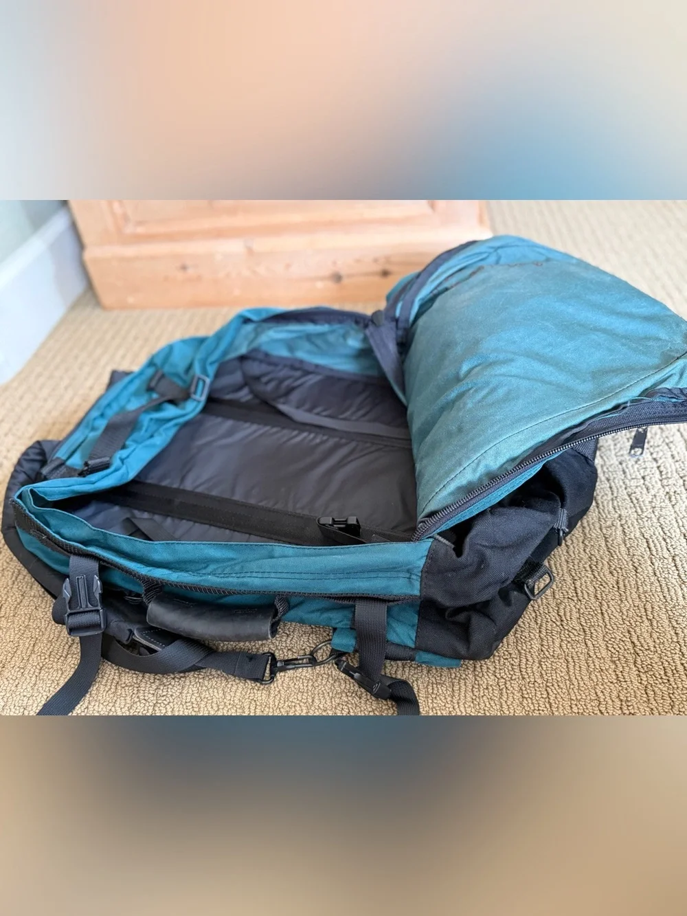 Teal and Black Vintage Eagle Creek Backpack with a day pack attached.